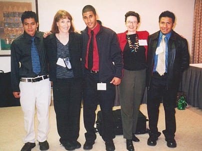 Carol Spellman with young men at AFS.