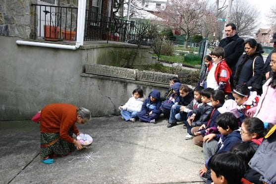 Students observe Samantha Mukkavilli making rangoli designs next to her home before interviewing her about the tradition, how she learned, and the role it plays in her life.
