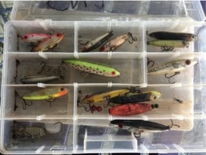 a bait box with colorful lures